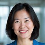 Dr. Emily Chen, a smiling Asian woman in professional attire, looking wise and approachable.