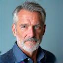 Portrait of Michael, a composed man in his early 50s.